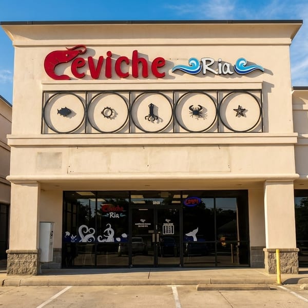 Exterior of Ceviche Ria restaurant with a red and blue sign, and seafood icons above the entrance.